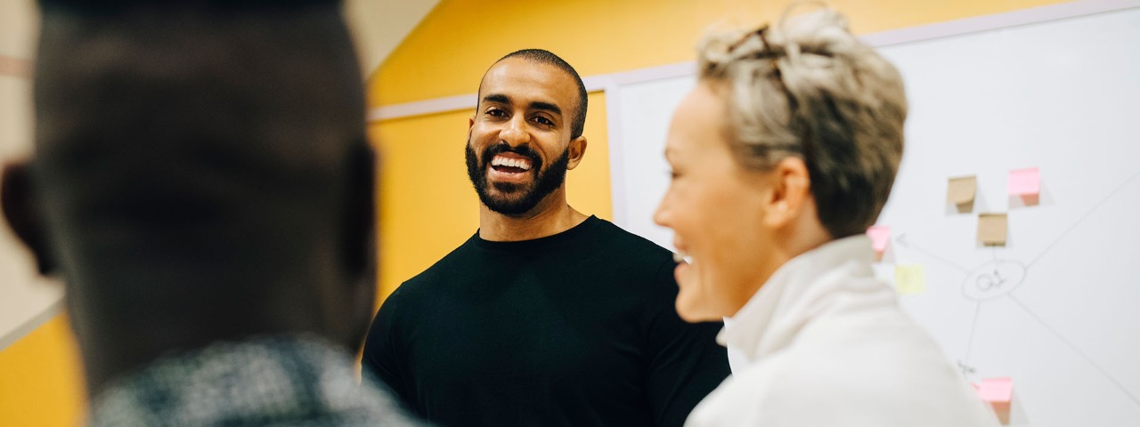 three people talking and laughing