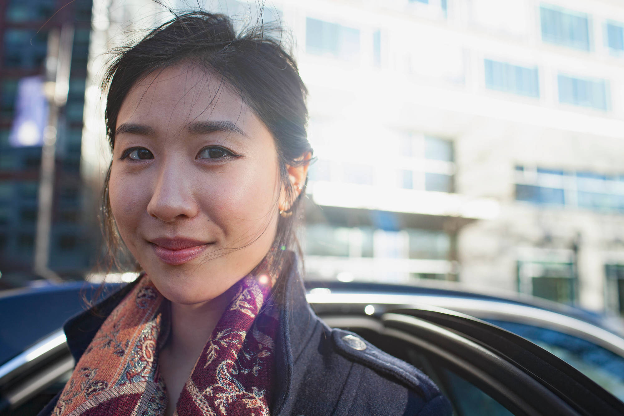 Young professional woman in business suit waiting to be interviewed in an office