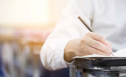 Image of a man sitting an exam