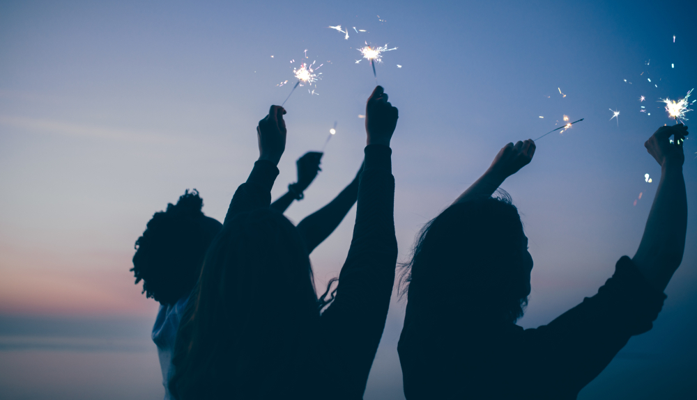 People holding sparklers People holding sparklers