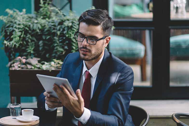 Person lovingly cradling a tablet device