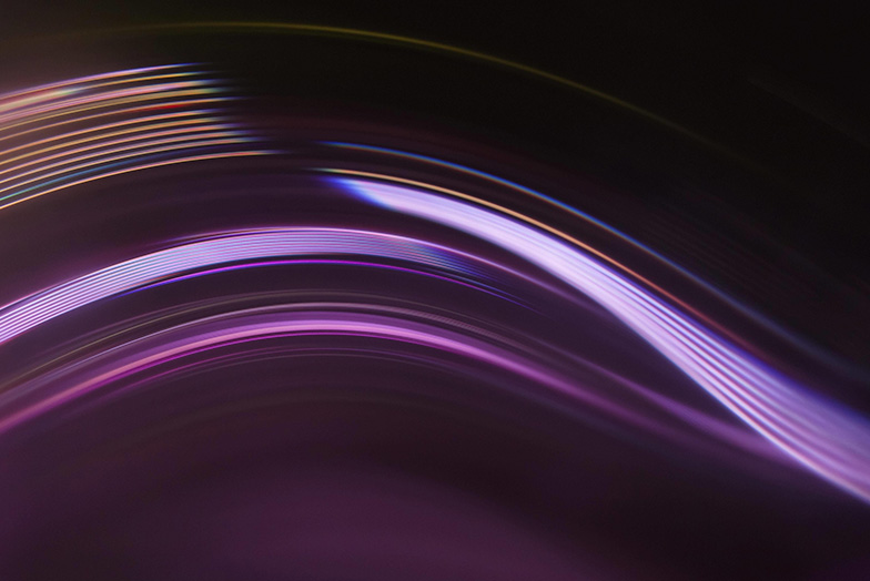 Shades of purple swirls on dark background