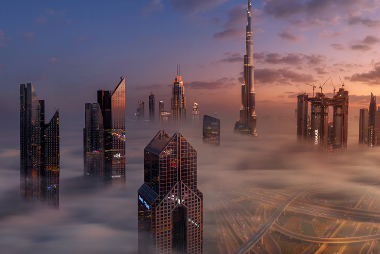 Skyscrapers rising through clouds