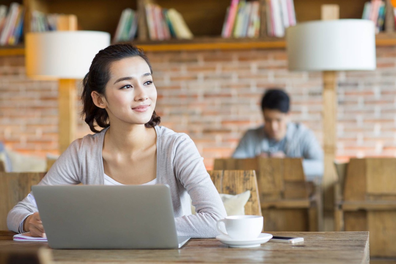 person at a desk with a computer