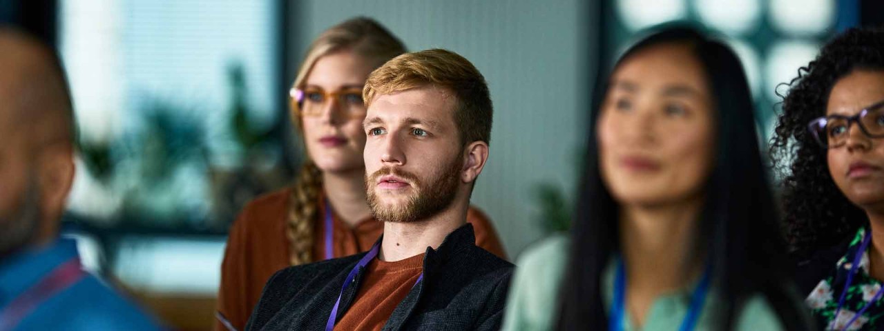people listening at conference