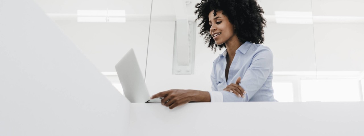 person on laptop at table